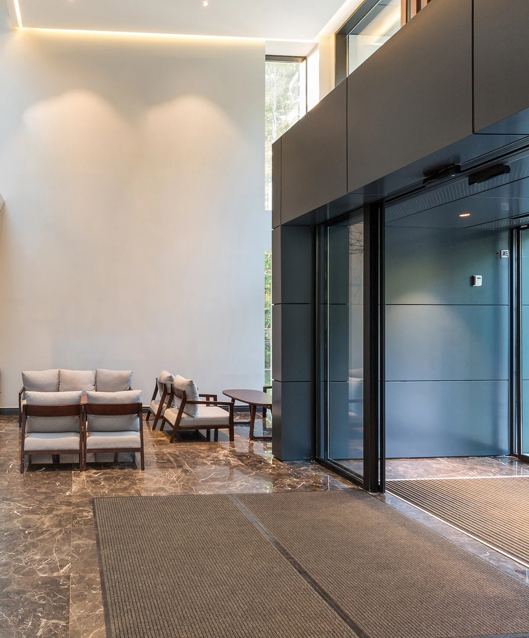 Modern dental office reception desk with warm wood finishes