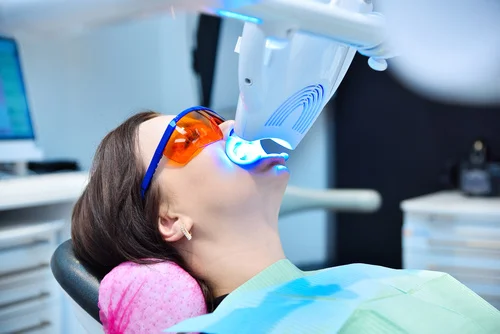 teeth-whitening-for-patient-in-protective-glasses